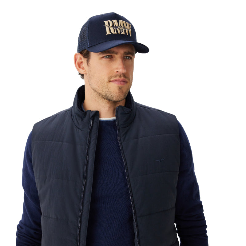 Man wearing a navy vest and cap with 'RMW' branding on a white background